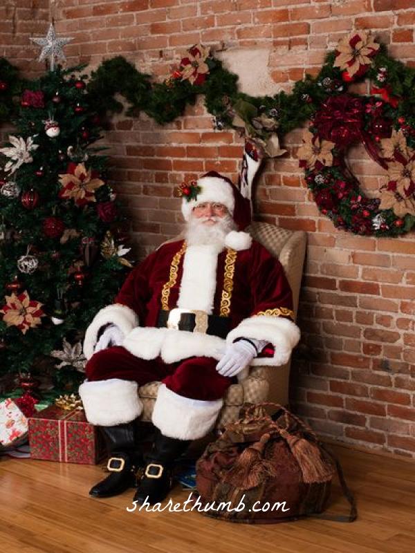 Santa clausse sit on the chair in front of x-mas tree